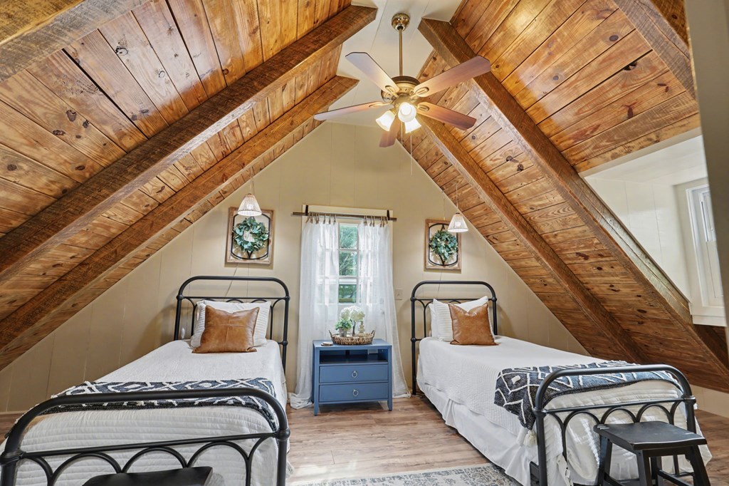 4609 Matheson Road Hiawassee, GA 30546 - Photo 33 of 57 a bedroom with a bed chair and a mirror