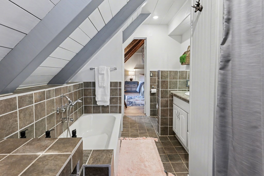 4609 Matheson Road Hiawassee, GA 30546 - Photo 35 of 57 a bathroom with a bathtub and shower