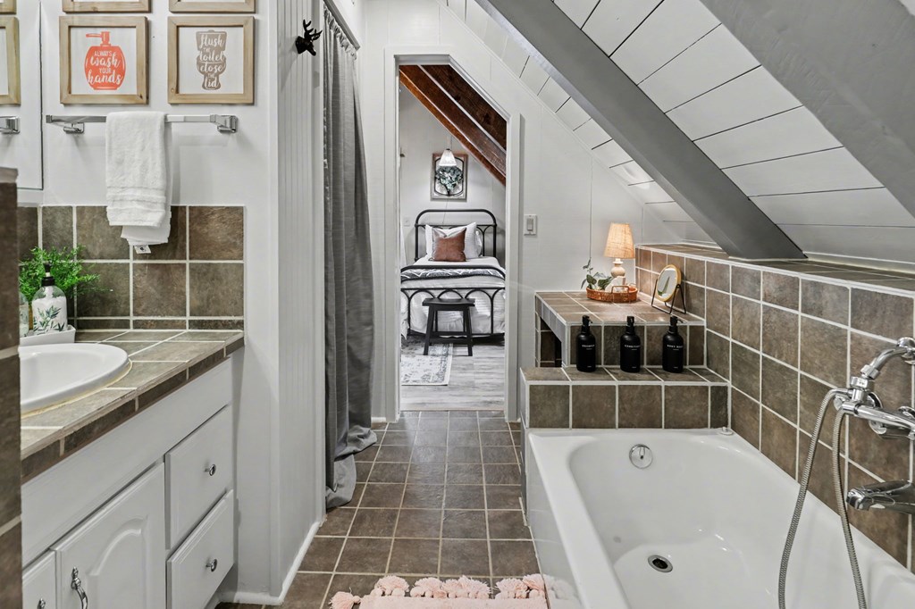 4609 Matheson Road Hiawassee, GA 30546 - Photo 36 of 57 a bath room with a tub and a shower