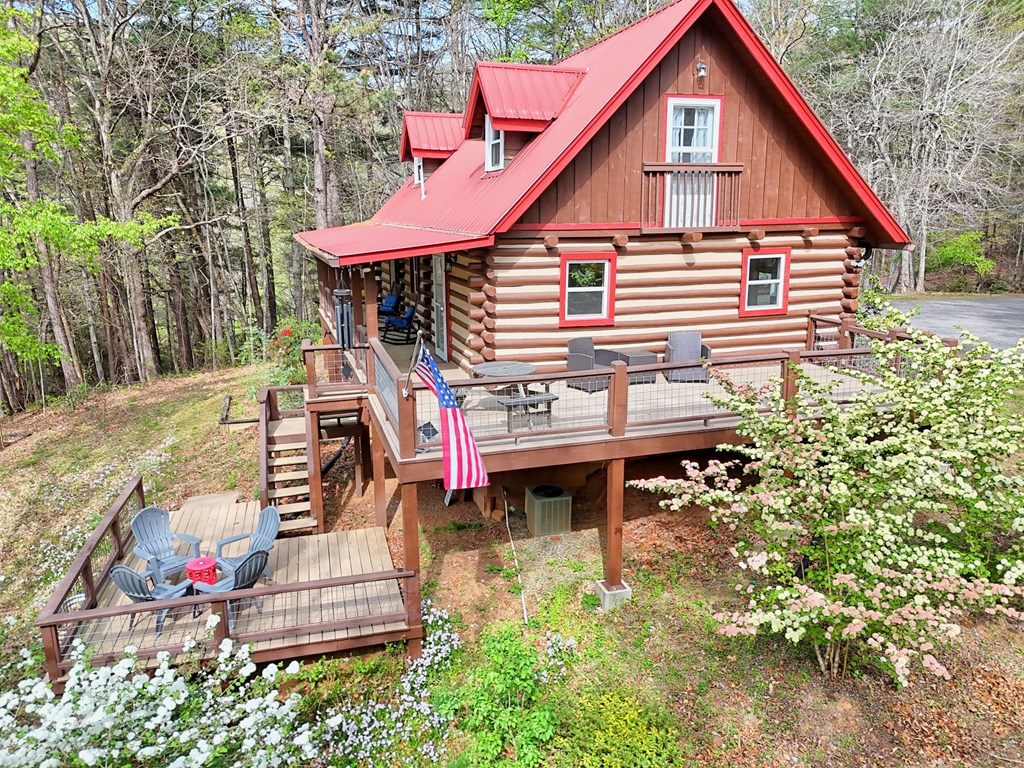 4609 Matheson Road Hiawassee, GA 30546 - Photo 4 of 57 a backyard of a house with table and chairs