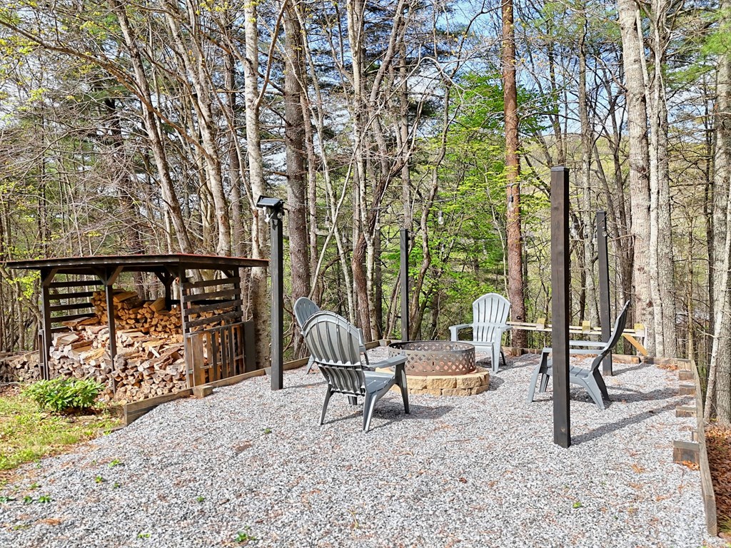 4609 Matheson Road Hiawassee, GA 30546 - Photo 56 of 57 a roof deck with table and chairs and potted plants