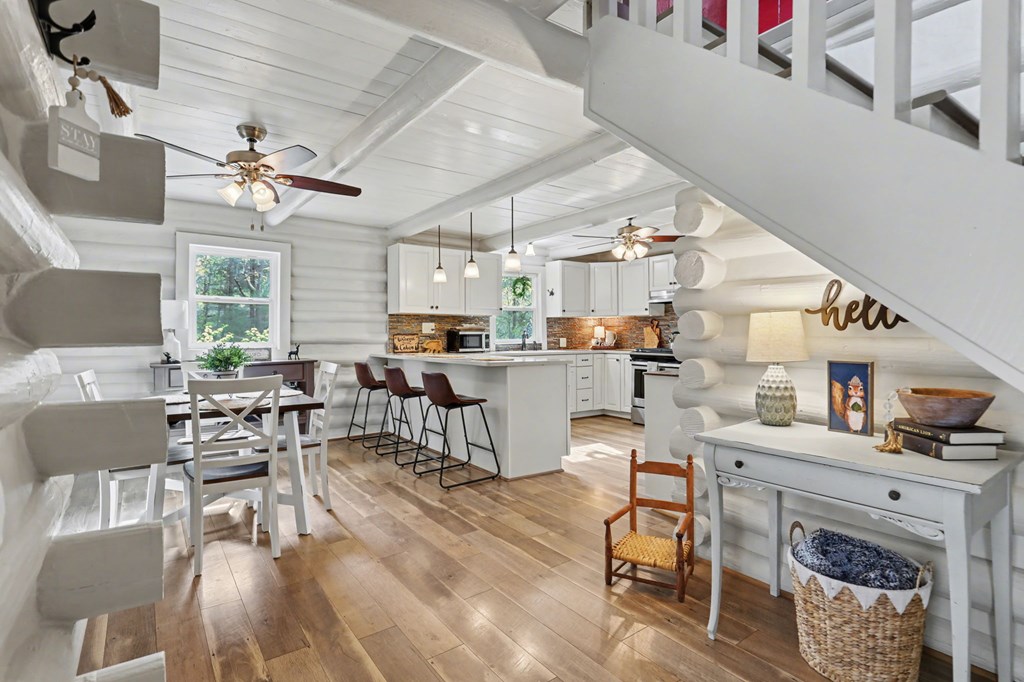4609 Matheson Road Hiawassee, GA 30546 - Photo 9 of 57 a living room with lots of furniture and kitchen view