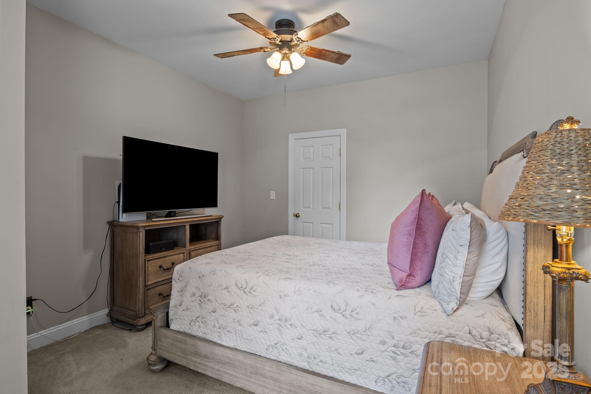 802 Seipel Drive Denver, NC 28037 - Photo 15 of 35 a bedroom with a bed and a flat screen tv