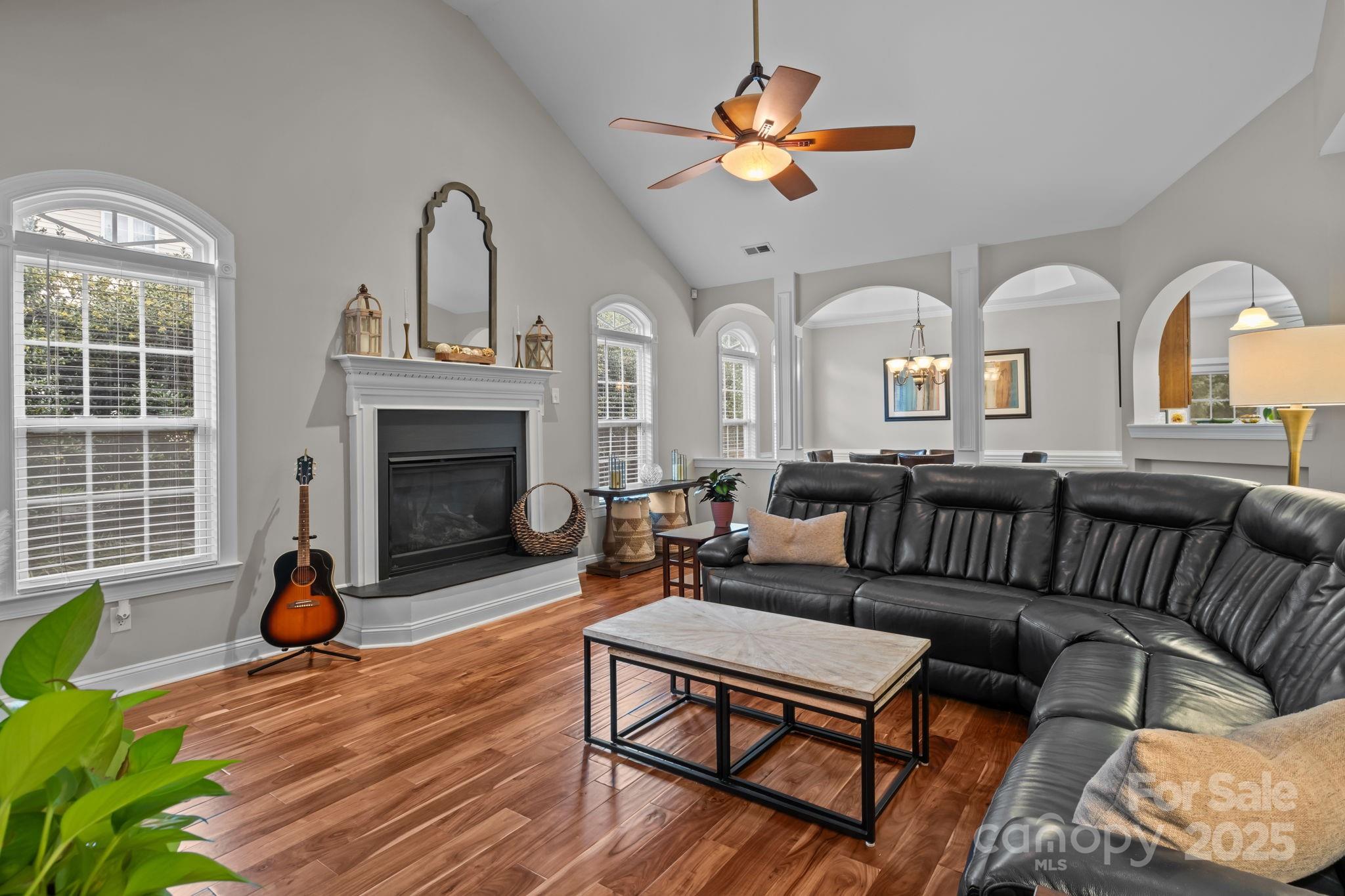 802 Seipel Drive Denver, NC 28037 - Photo 17 of 35 a living room with furniture a fireplace and a flat screen tv