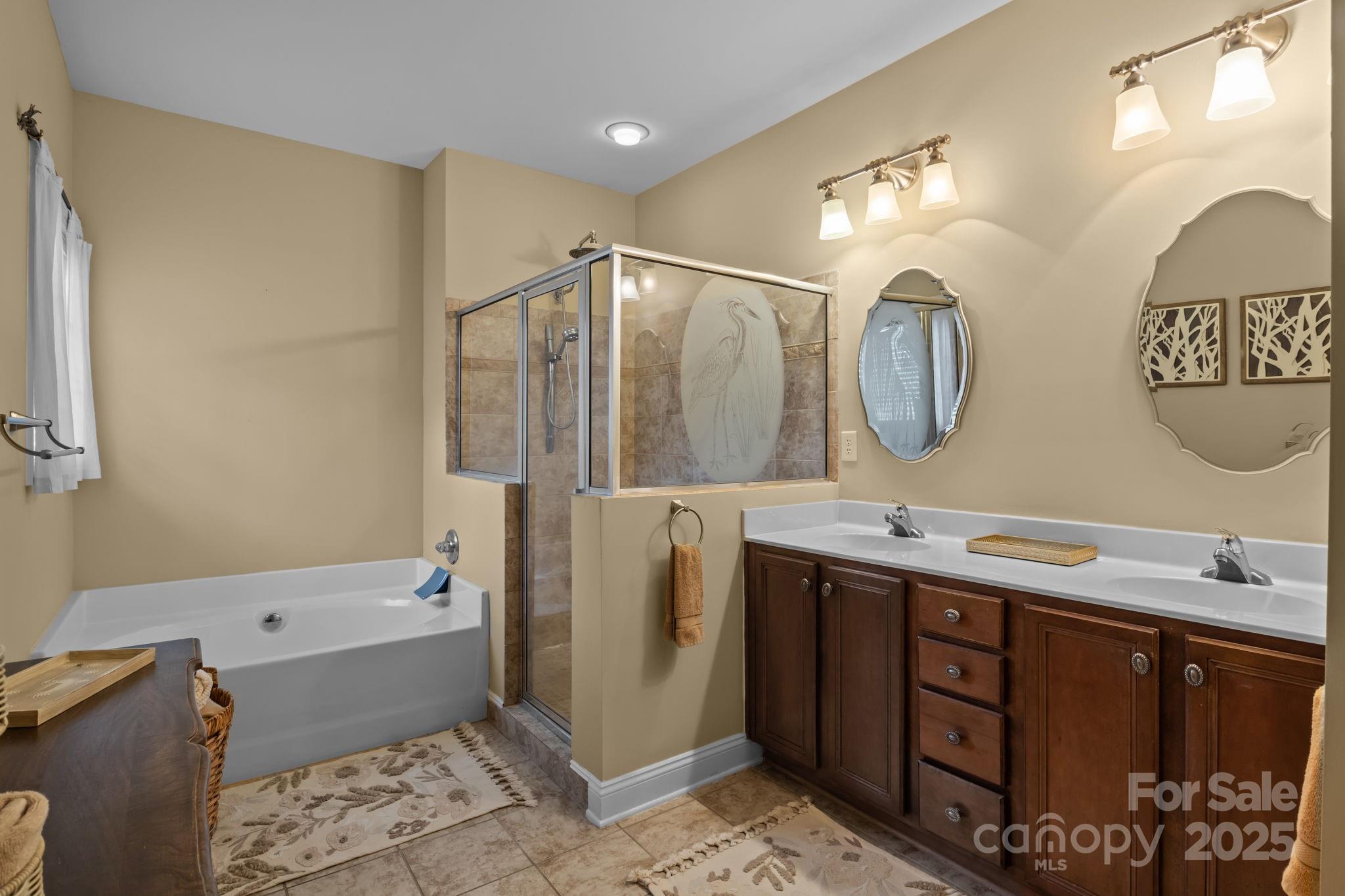 802 Seipel Drive Denver, NC 28037 - Photo 32 of 35 a bathroom with a double vanity sink mirror and bathtub