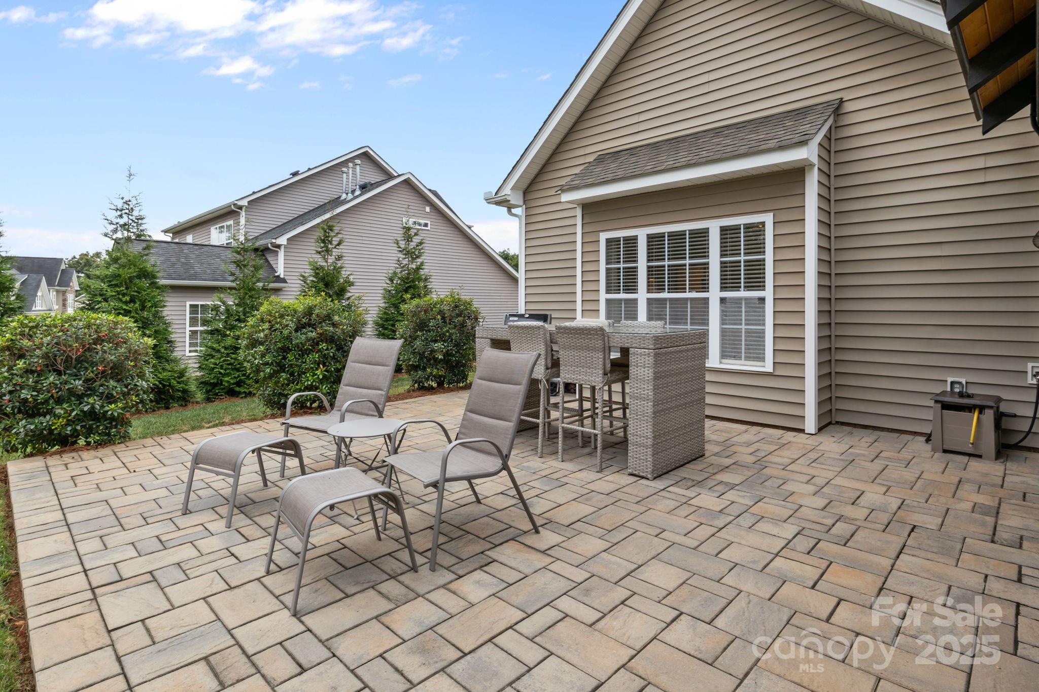 802 Seipel Drive Denver, NC 28037 - Photo 9 of 35 a view of a patio with table and chairs and potted plants