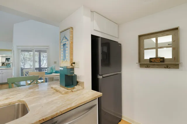 a kitchen that has a sink and a stove top oven