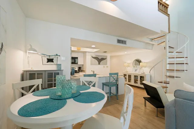 a kitchen with a refrigerator and a stove top oven