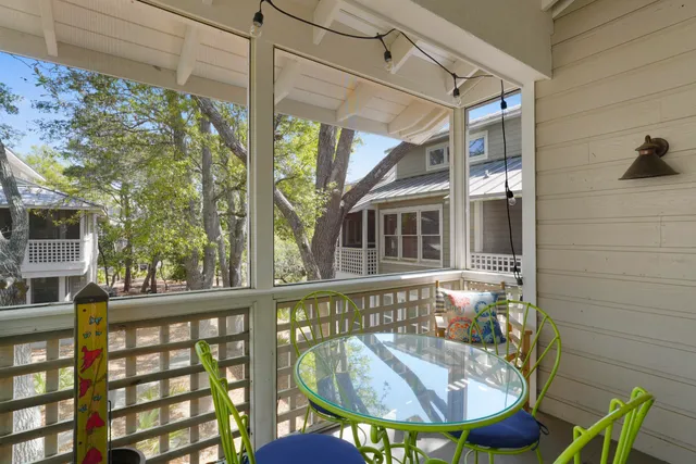 a balcony filled with furniture and rug