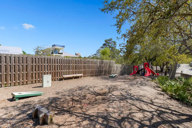 a view of a house with pool and chairs