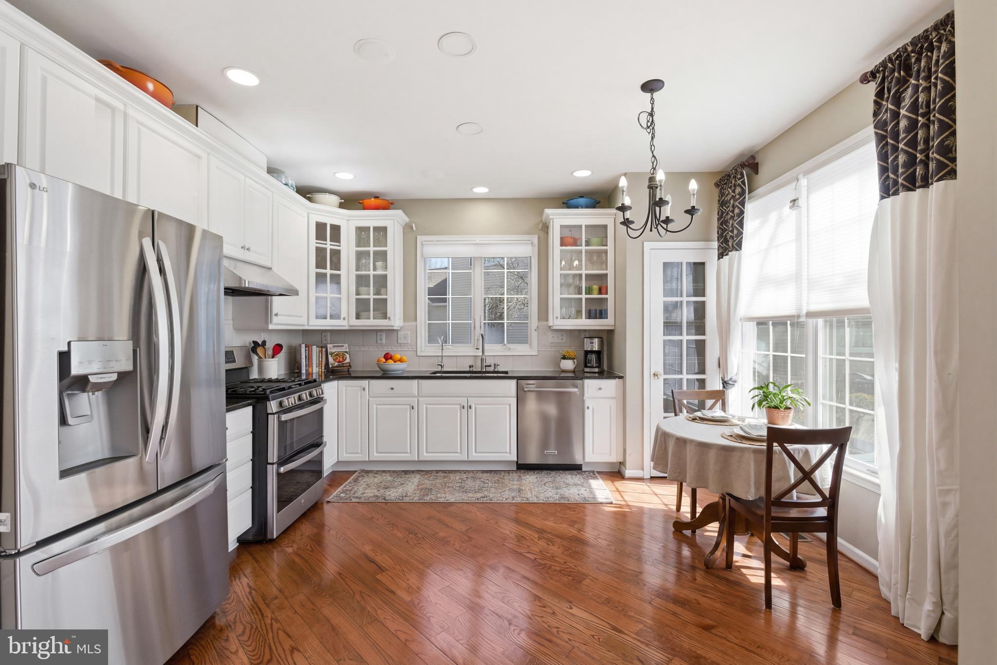 45 Tree Swallow Drive Princeton, NJ 08540 - Photo 12 of 41 a kitchen with a table chairs refrigerator and microwave