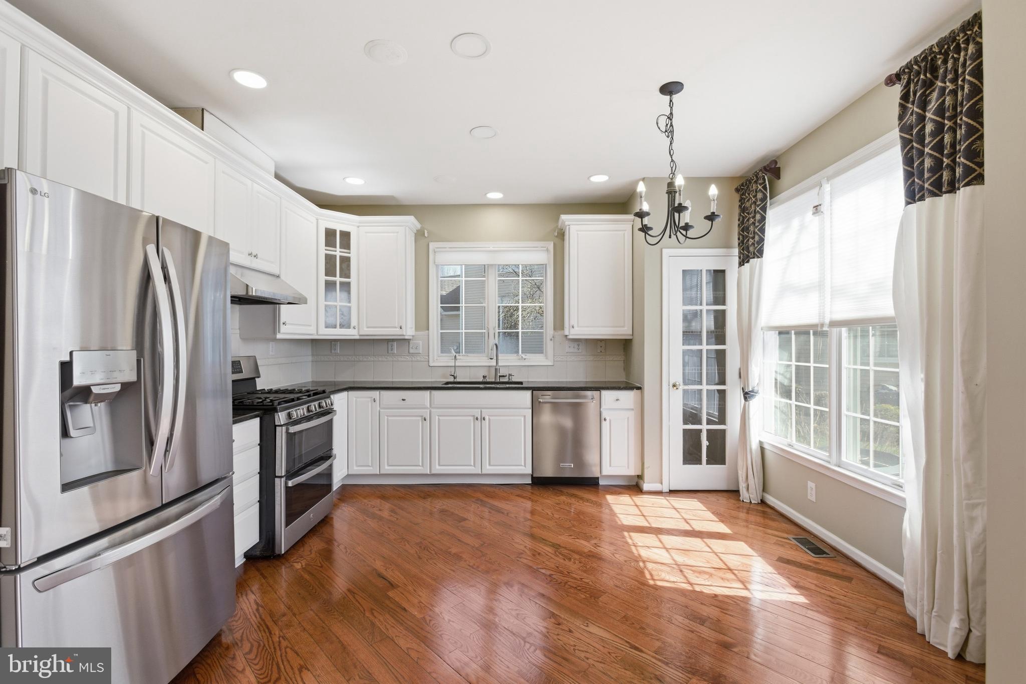 45 Tree Swallow Drive Princeton, NJ 08540 - Photo 13 of 41 a kitchen with stainless steel appliances a refrigerator sink and microwave