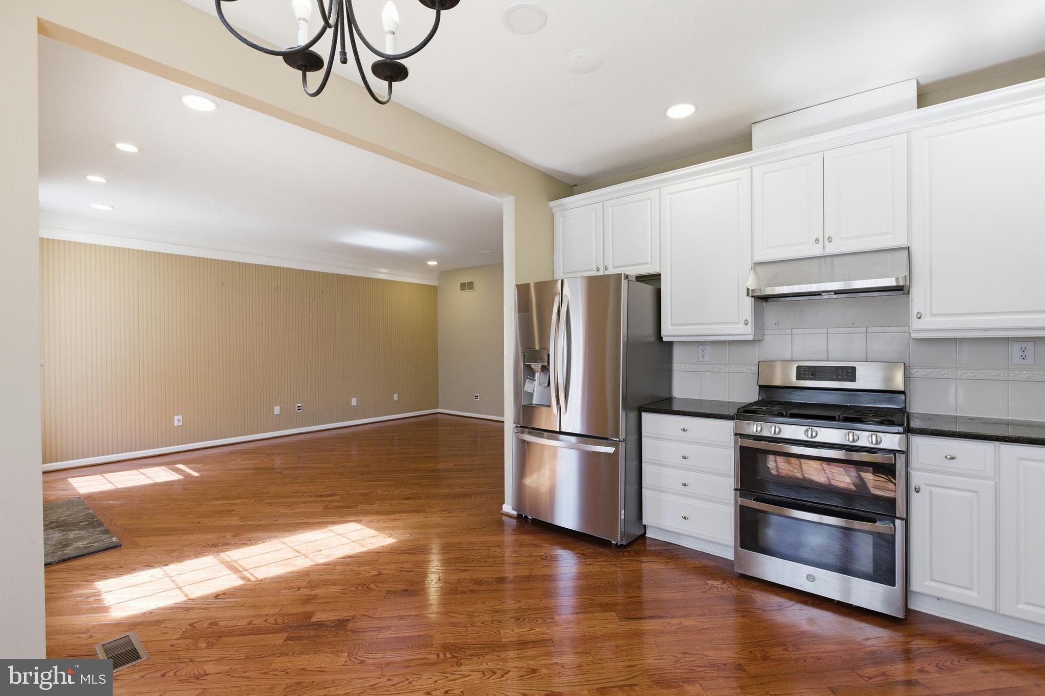 45 Tree Swallow Drive Princeton, NJ 08540 - Photo 14 of 41 a kitchen with stainless steel appliances a refrigerator and a stove top oven