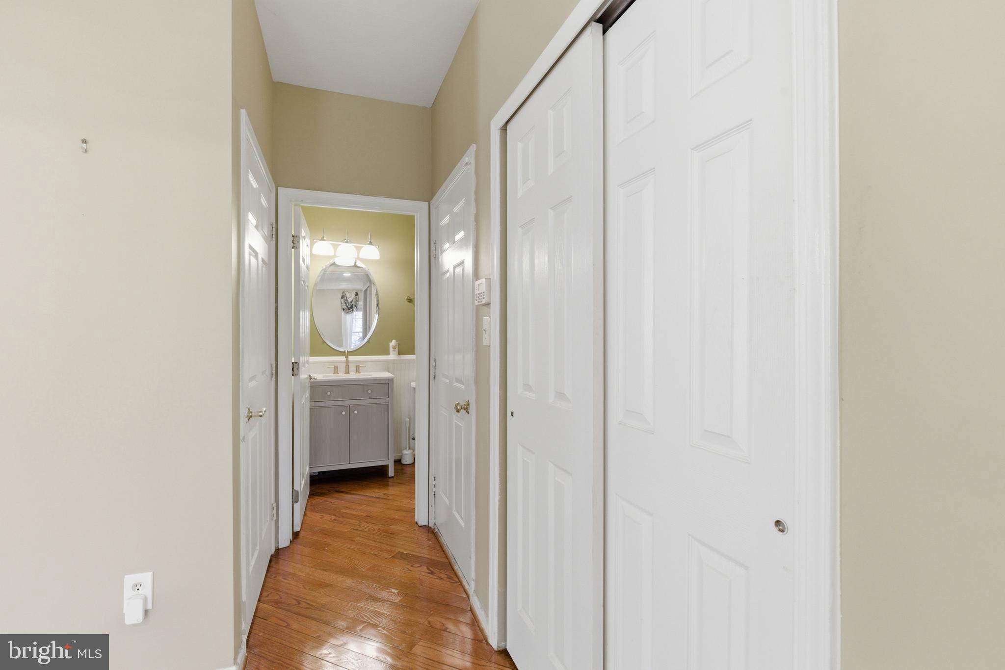 45 Tree Swallow Drive Princeton, NJ 08540 - Photo 22 of 41 a view of a hallway with a livingroom and a bathroom with sink