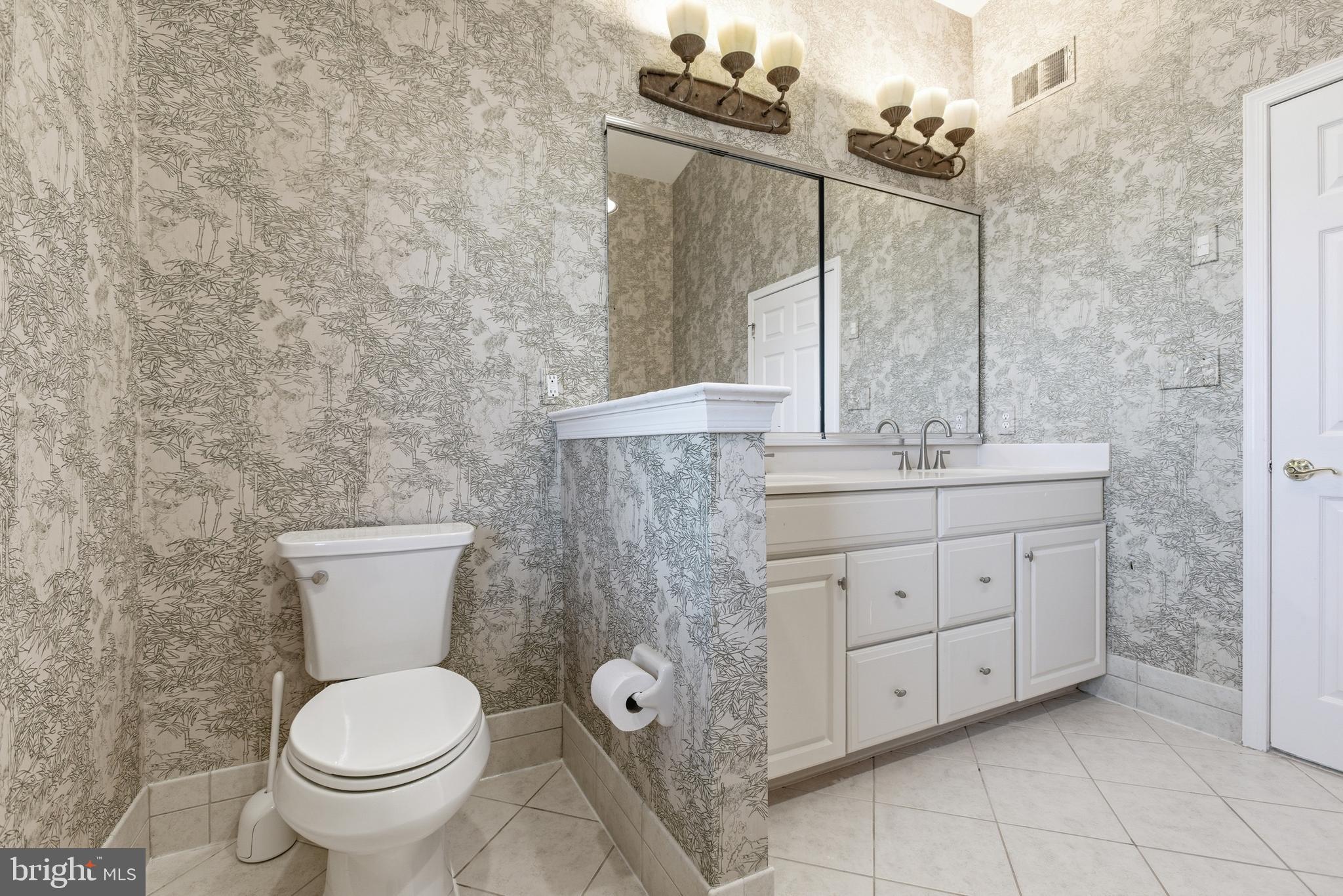 45 Tree Swallow Drive Princeton, NJ 08540 - Photo 24 of 41 a bathroom with a granite countertop toilet sink and mirror