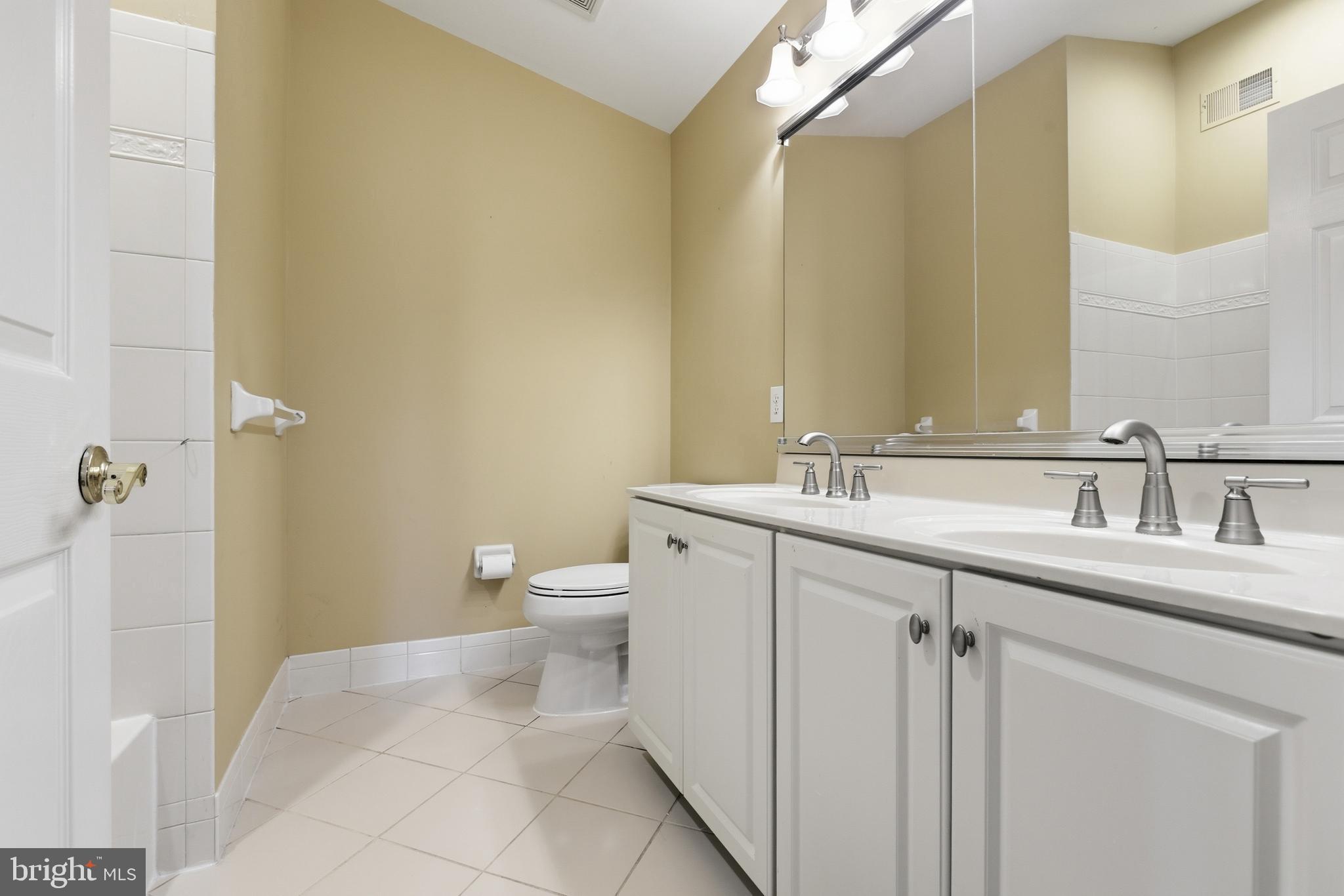 45 Tree Swallow Drive Princeton, NJ 08540 - Photo 25 of 41 a bathroom with a sink a toilet and a mirror