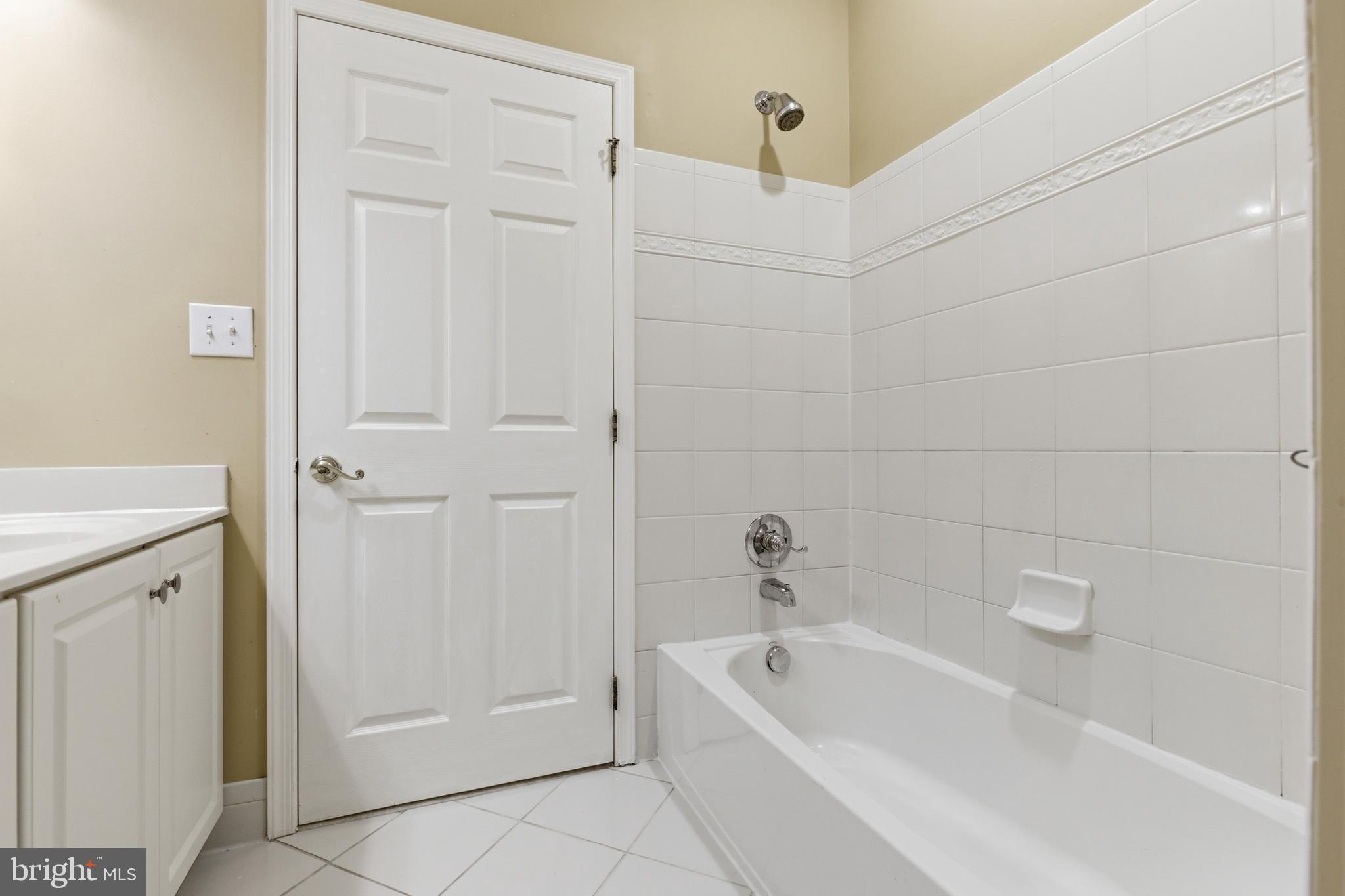 45 Tree Swallow Drive Princeton, NJ 08540 - Photo 26 of 41 a bathroom with a tub a sink and a shower