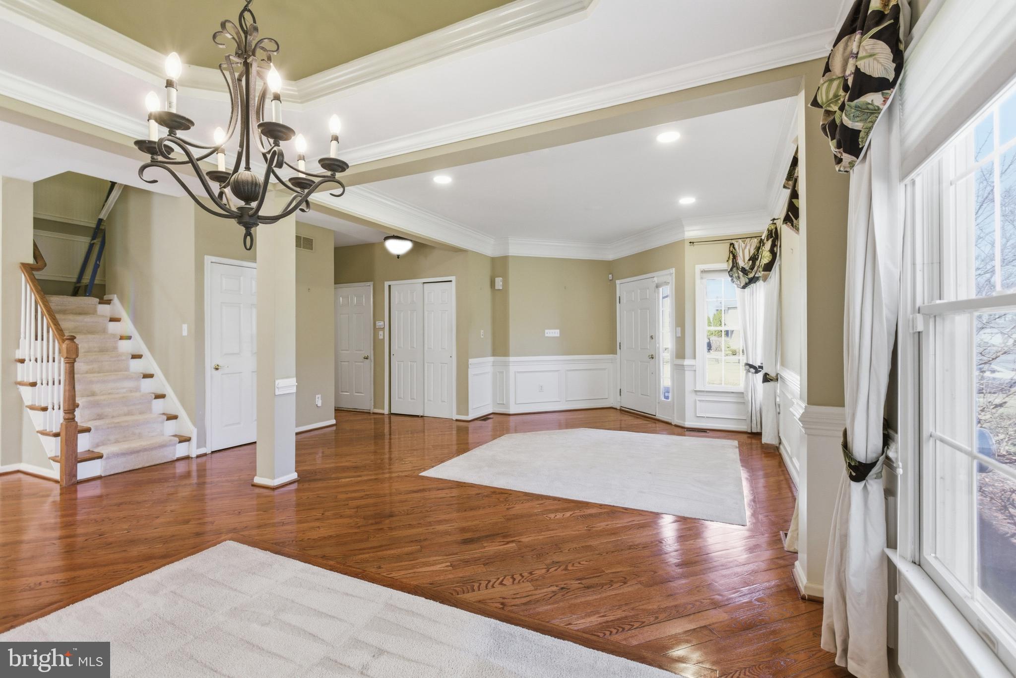 45 Tree Swallow Drive Princeton, NJ 08540 - Photo 7 of 41 a view of an entryway with wooden floor and a chandelier