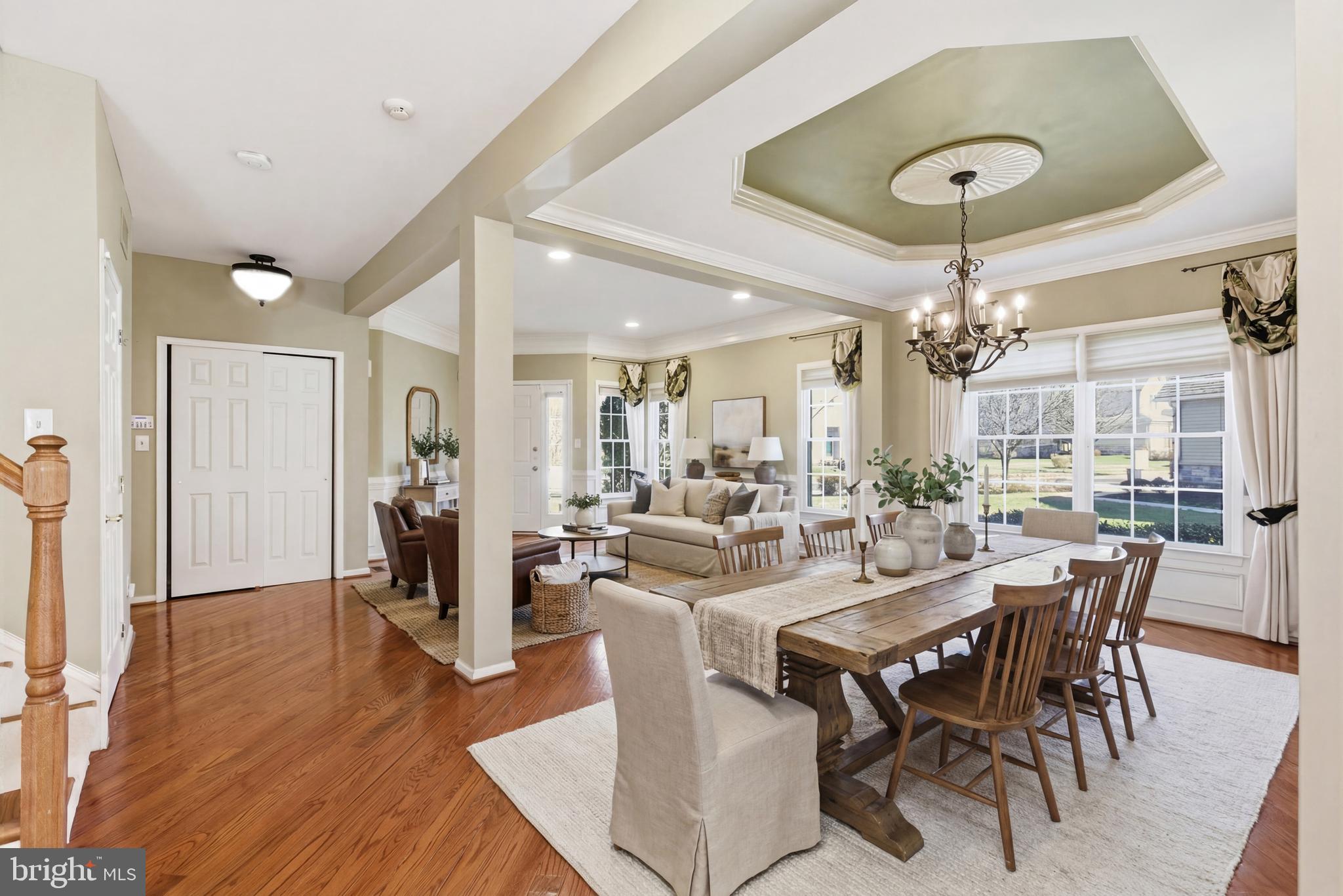 45 Tree Swallow Drive Princeton, NJ 08540 - Photo 8 of 41 a view of a dining room and livingroom with furniture wooden floor a chandelier