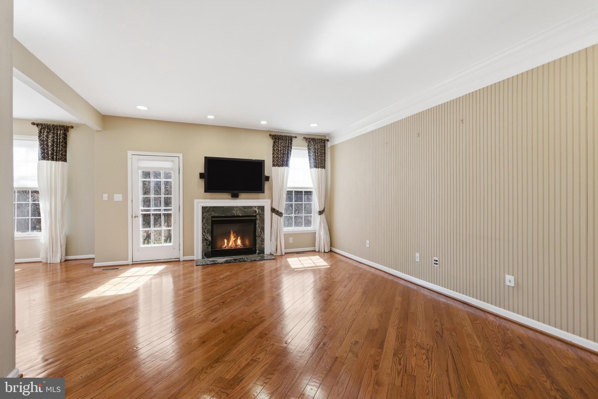 45 Tree Swallow Drive Princeton, NJ 08540 - Photo 10 of 41 a view of a livingroom with wooden floor and a fireplace