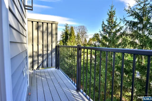 a view of balcony with wooden floor