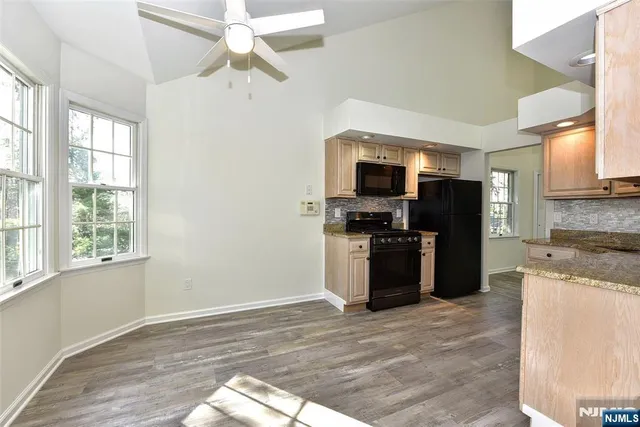 a kitchen with a refrigerator stove and microwave