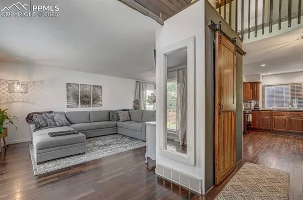 a living room with furniture and a window