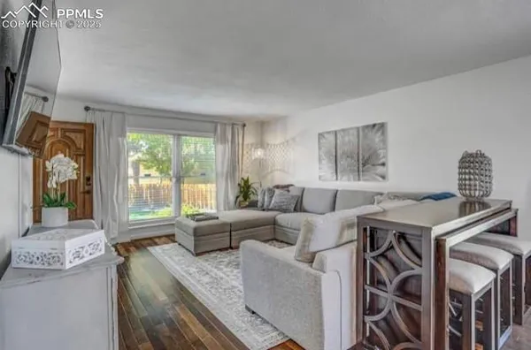 a living room with furniture and a window