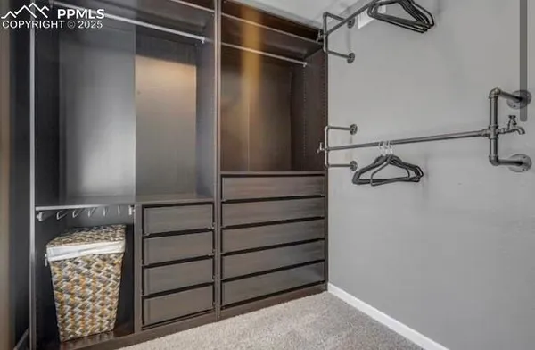 a bathroom with double vanity sinks and two mirror