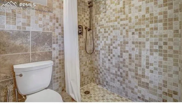 a bathroom with a sink double vanity and shower