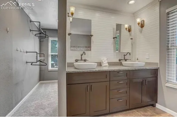 a bedroom with a bed and a fireplace