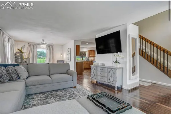 a living room with furniture and a table