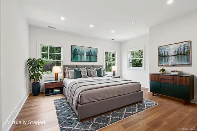 a bedroom with a large bed and a couch