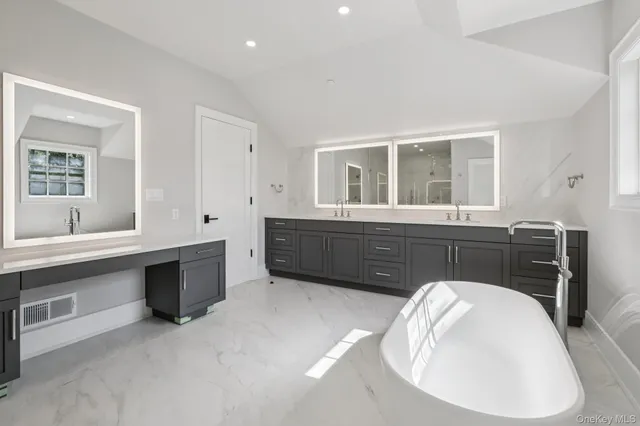a en suite bathroom with a sink and a mirror