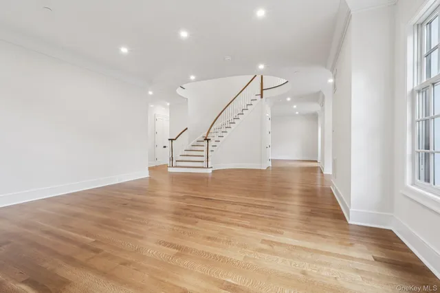 a view of an entryway with wooden floor