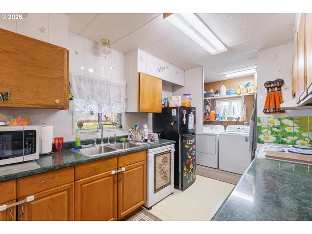 a kitchen with a sink cabinets and counter space