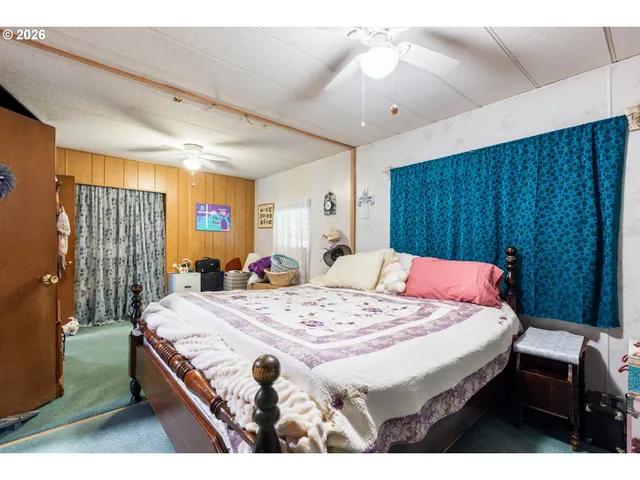 a bed room with a bed and a dresser