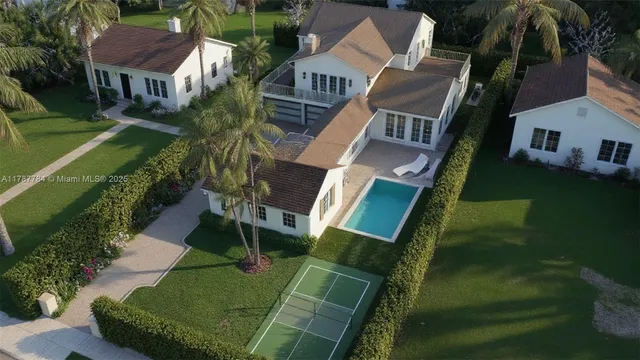 an aerial view of multiple houses with yard