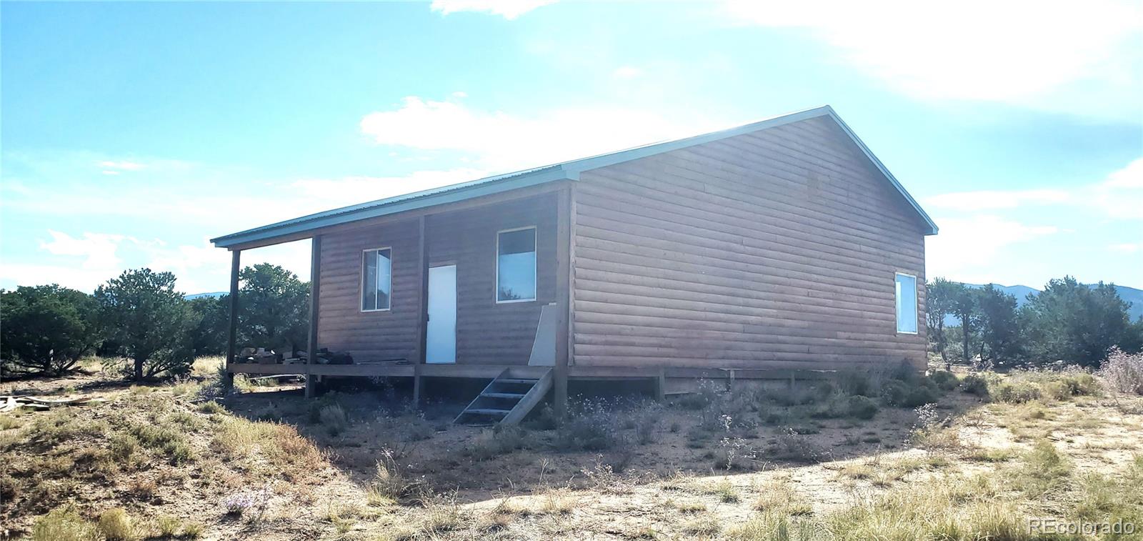 a backyard of a house with lots of green space