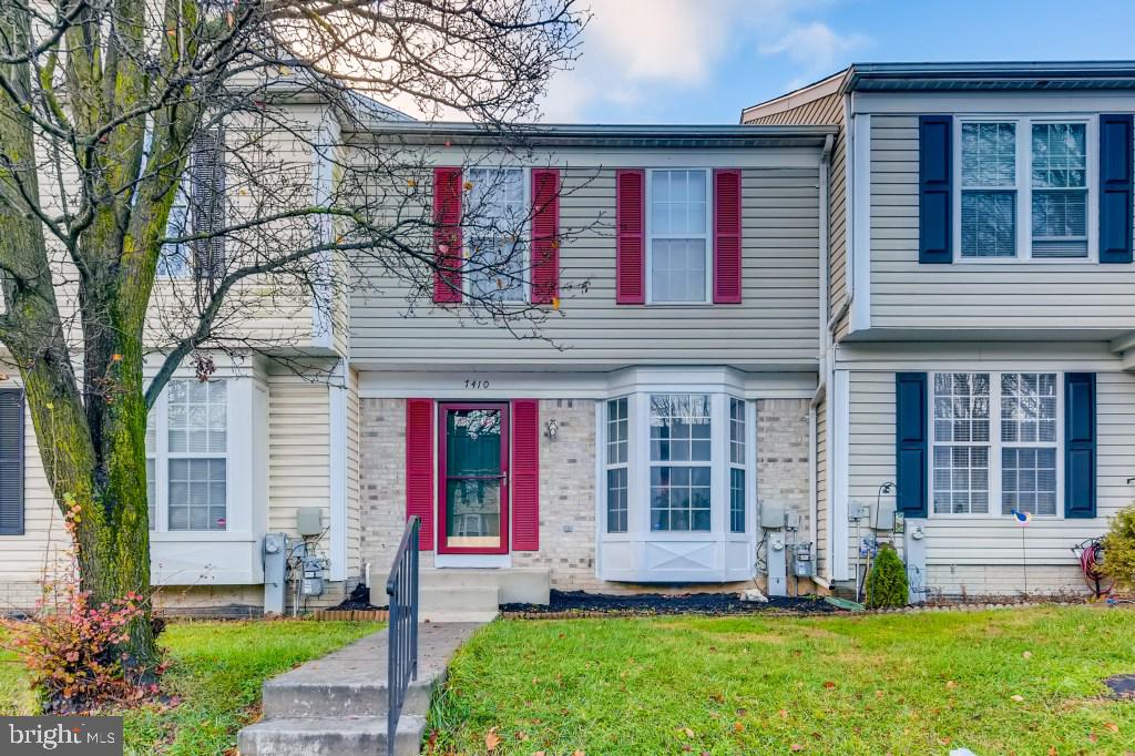 7410 Maury Road Windsor Mill, MD 21244 - Photo 1 of 28 a front view of a house with a yard and plants