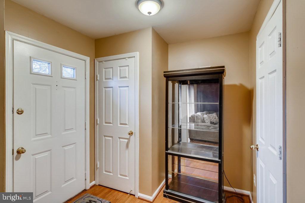 7410 Maury Road Windsor Mill, MD 21244 - Photo 3 of 28 a view of a hallway with wooden floor