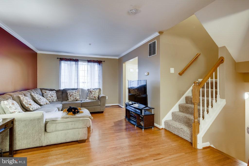 7410 Maury Road Windsor Mill, MD 21244 - Photo 5 of 28 a living room with furniture and hard wood flooring
