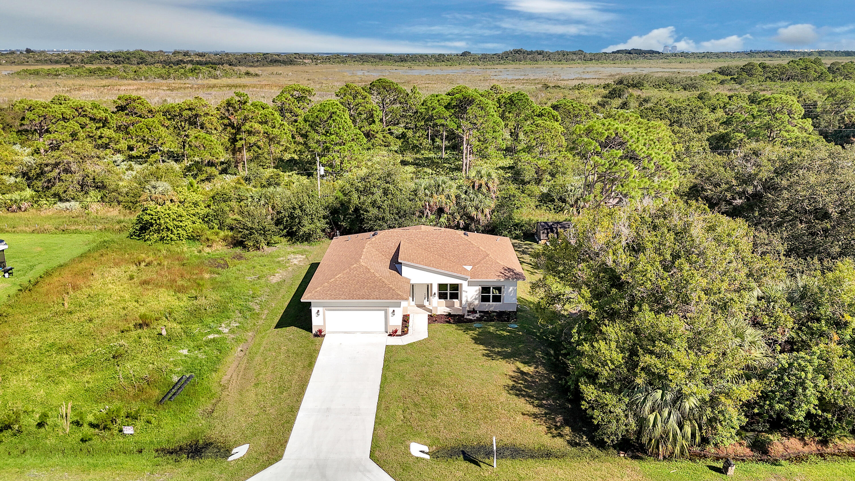 5310 Sunset Boulevard Fort Pierce, FL 34982 - Photo 1 of 39 a aerial view of a house with a yard