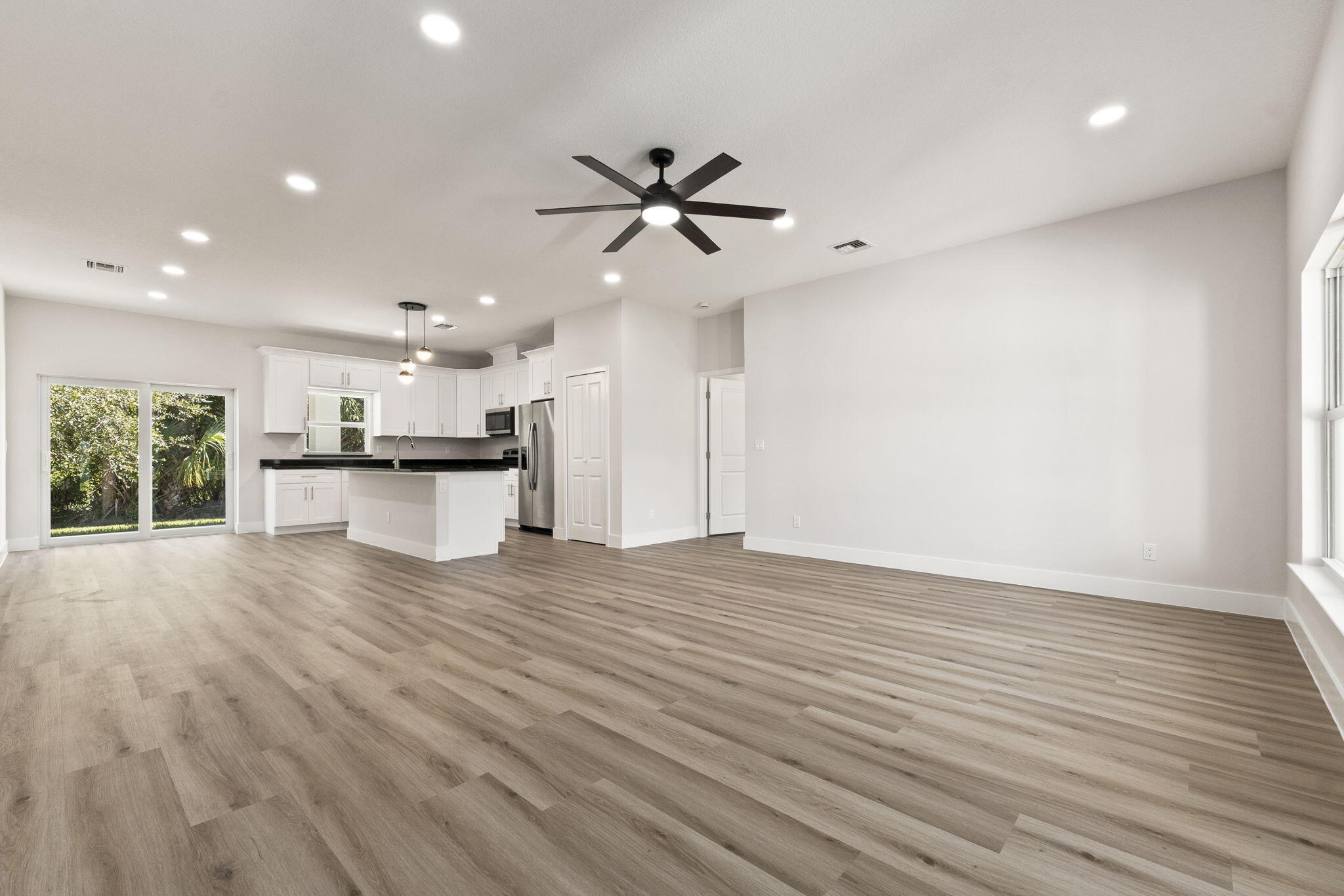 5310 Sunset Boulevard Fort Pierce, FL 34982 - Photo 11 of 39 a view of a kitchen with a sink and wooden floor