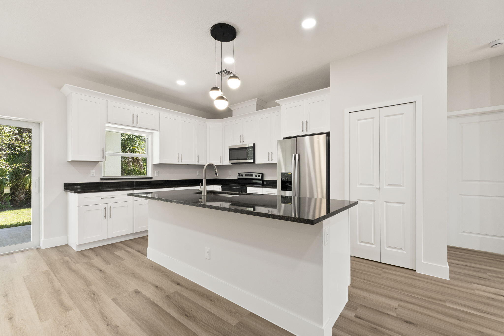 5310 Sunset Boulevard Fort Pierce, FL 34982 - Photo 13 of 39 a kitchen with stainless steel appliances a refrigerator sink and microwave