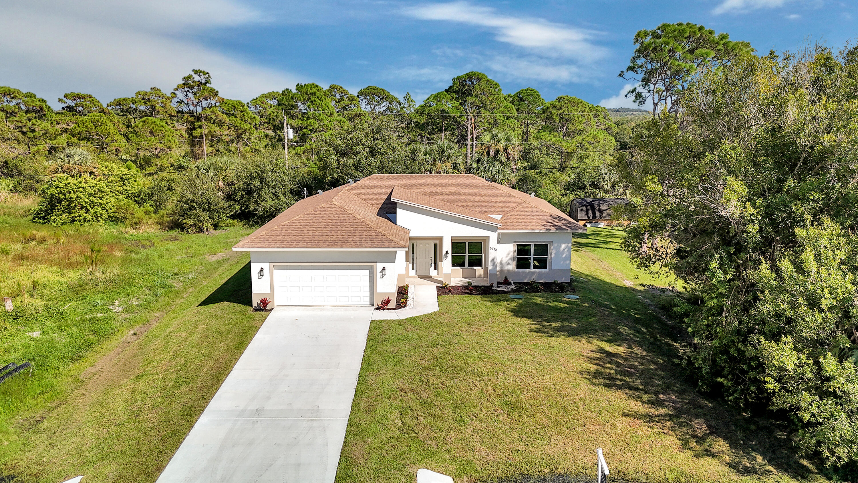 5310 Sunset Boulevard Fort Pierce, FL 34982 - Photo 2 of 39 a view of a house with garden