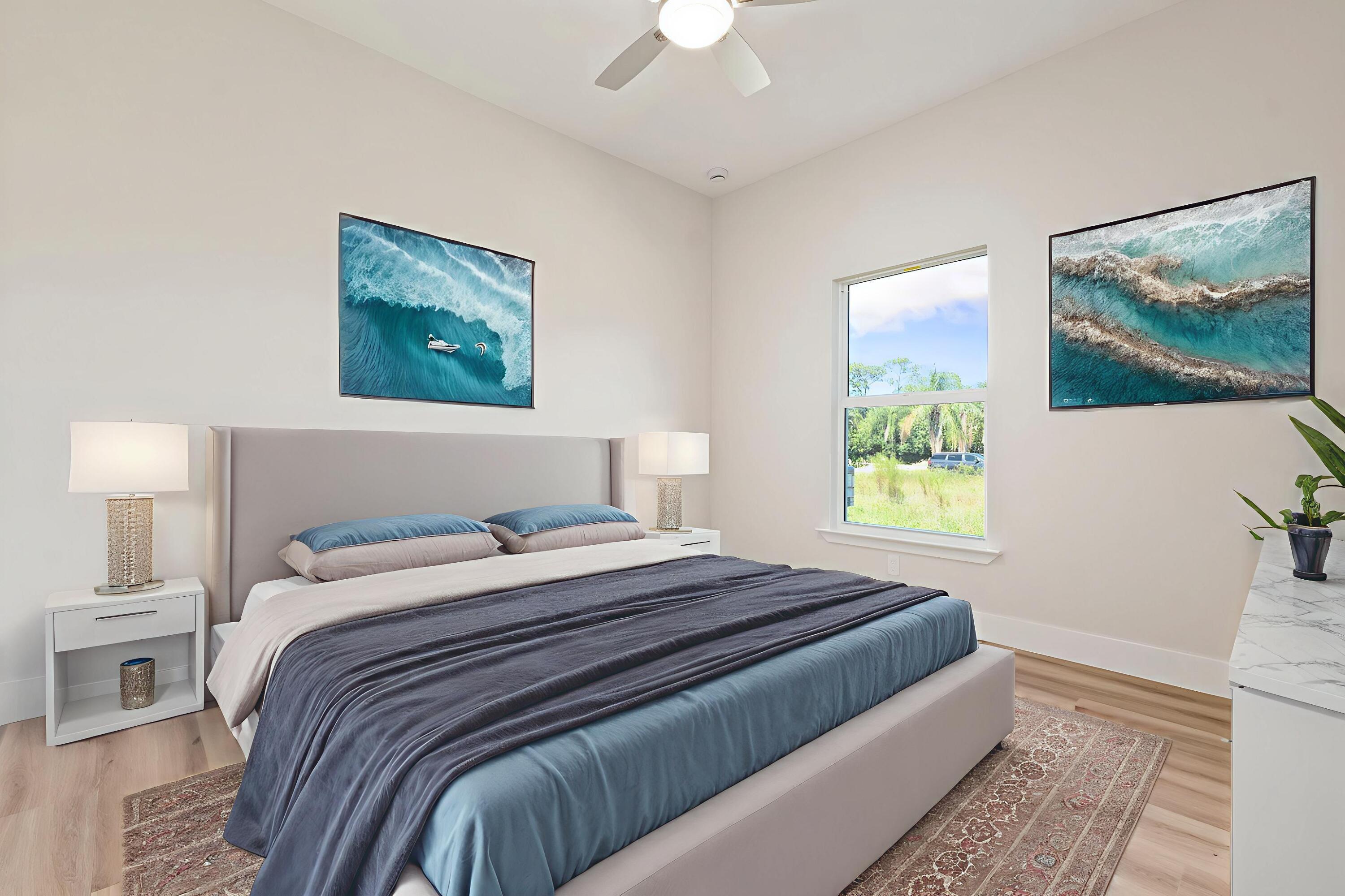 5310 Sunset Boulevard Fort Pierce, FL 34982 - Photo 29 of 39 a bedroom with a bed and a painting on the wall