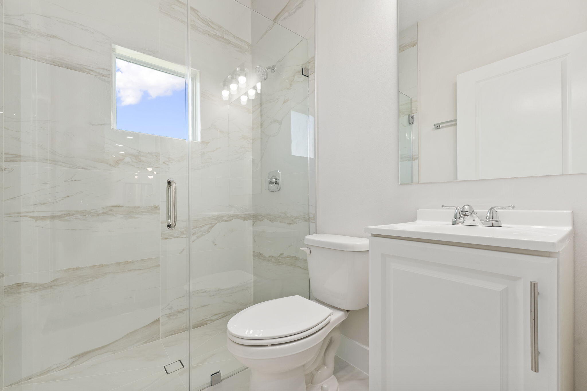 5310 Sunset Boulevard Fort Pierce, FL 34982 - Photo 30 of 39 a bathroom with a sink toilet and shower