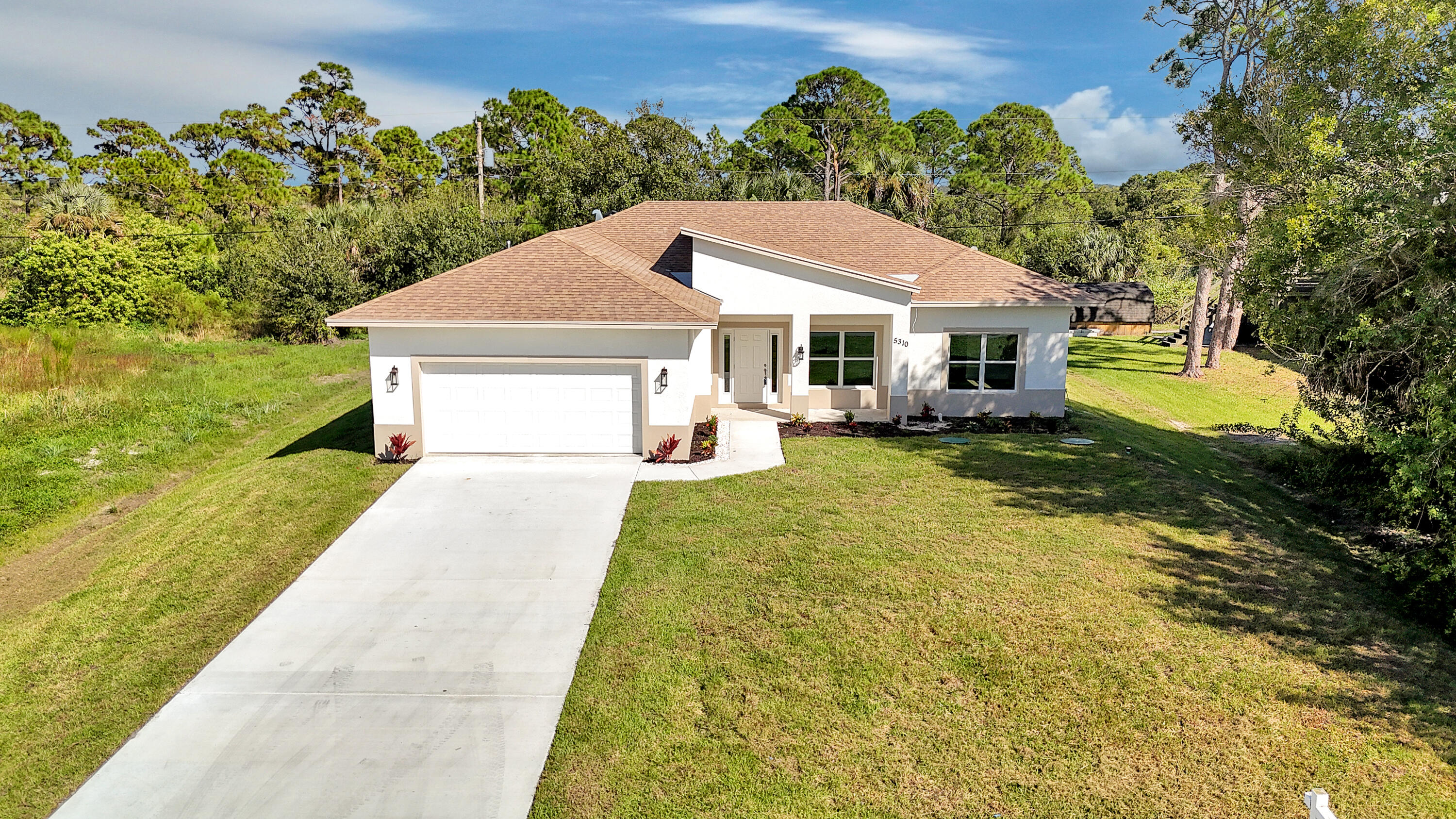 5310 Sunset Boulevard Fort Pierce, FL 34982 - Photo 3 of 39 a front view of a house with yard