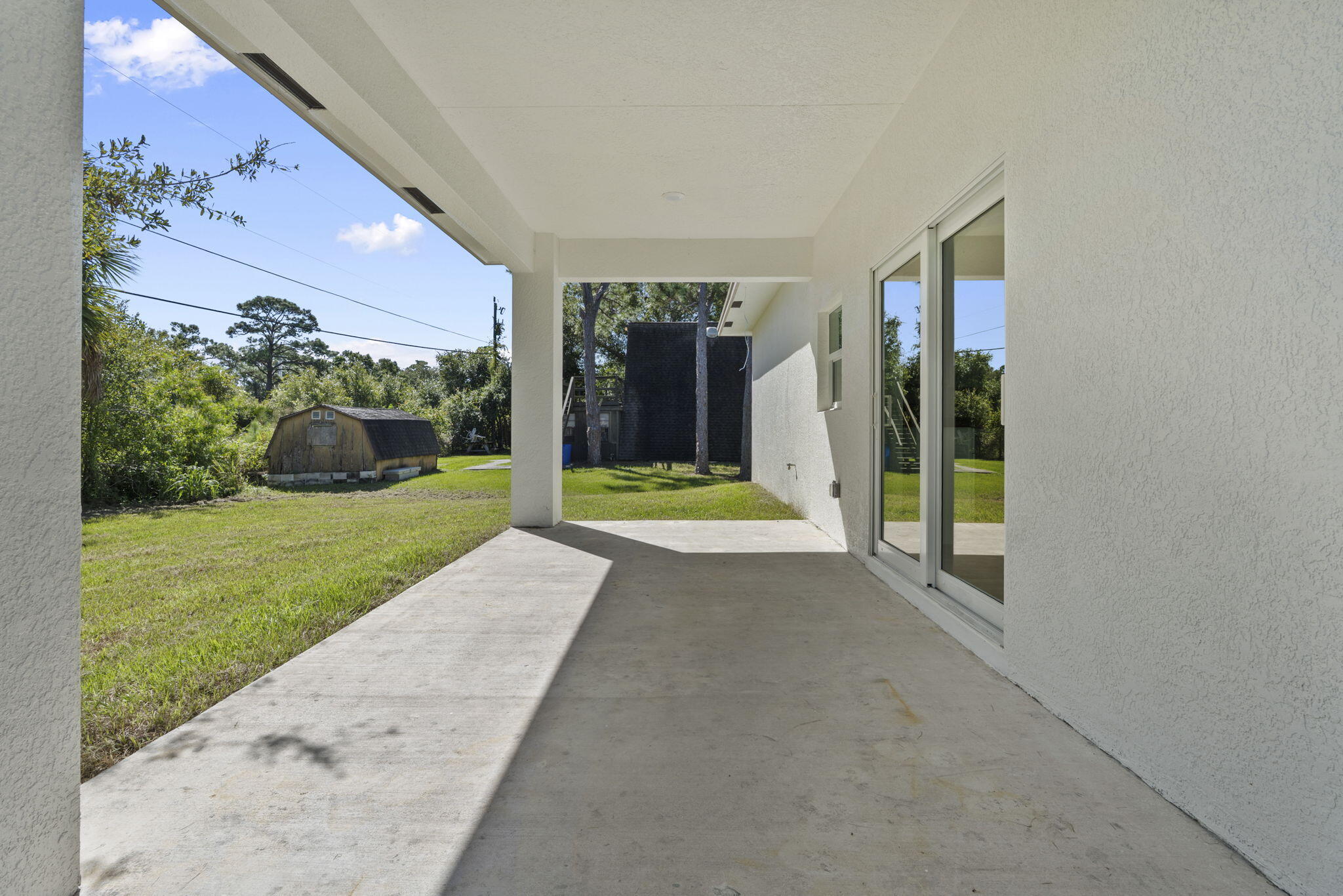 5310 Sunset Boulevard Fort Pierce, FL 34982 - Photo 35 of 39 a view of a house with backyard and porch